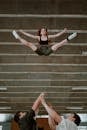 Woman in Black Tank Top and Black Leggings Lying on Stairs