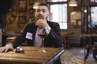 Handsome Man with Name Tag on his Black Blazer