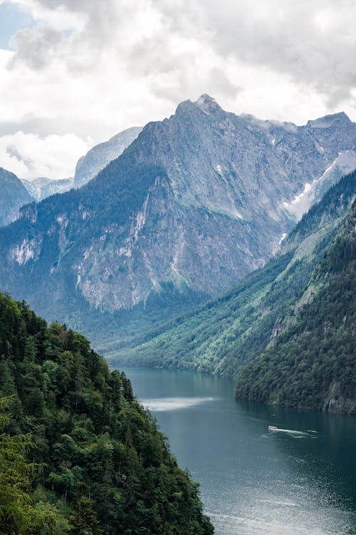 Free Body of Water Near Beautiful Mountains Stock Photo