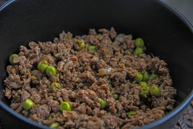 Ground Meat With Green Peas In A Bowl