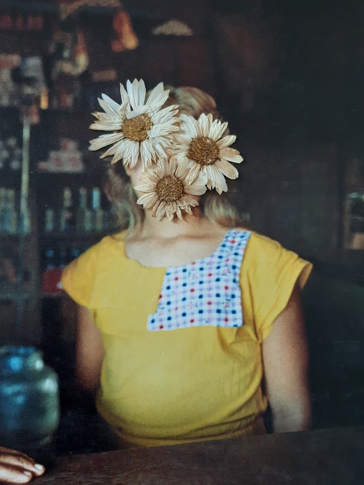 Photograph Of Dry Flowers On A Woman's Face