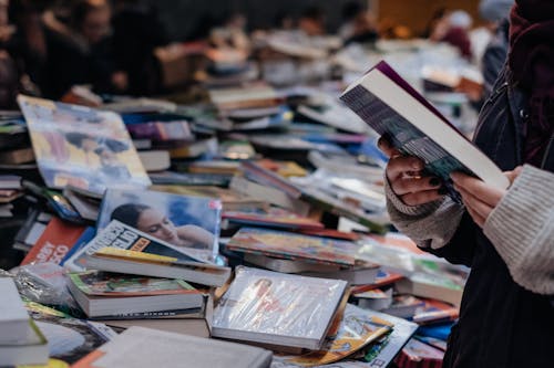 A Person Selecting a Book