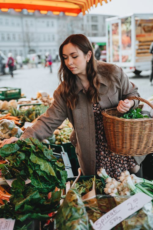 Free Photograph of a Woman Buying Green Vegetables Stock Photo