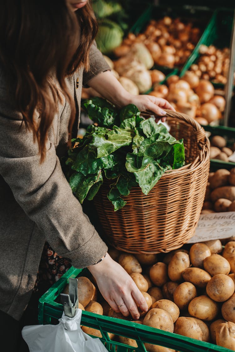 Woman Buying Vegetables