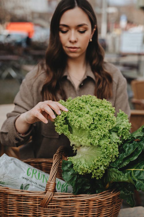 Woman Holding Green Vegetables 