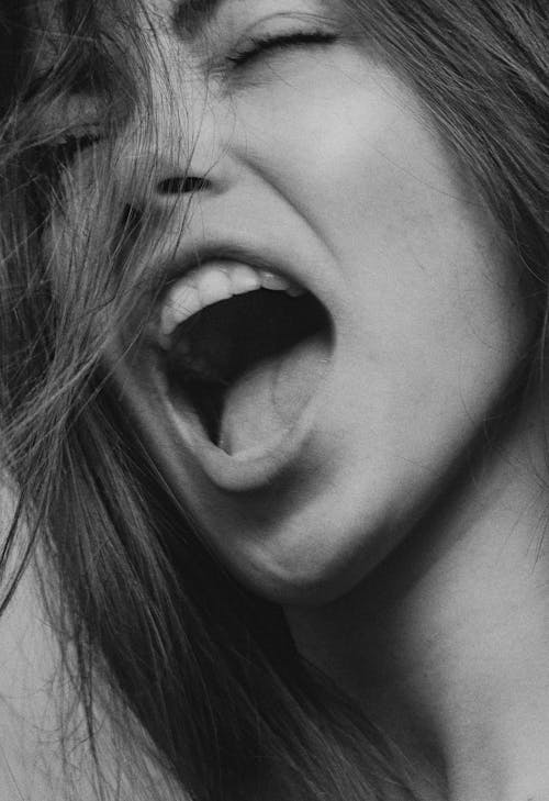 Free Grayscale Photography of a Woman Screaming Stock Photo