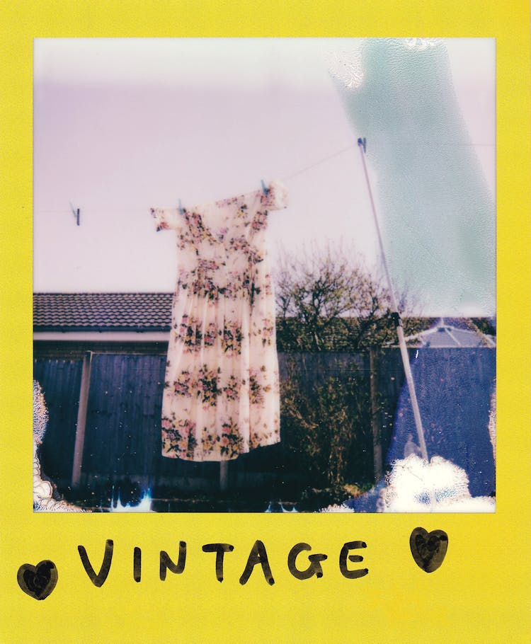 A Floral Dress Hanging On A Clothes Line