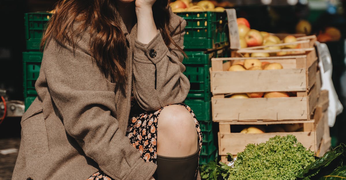 A Woman in Brown Trench Coat Shopping in the Market