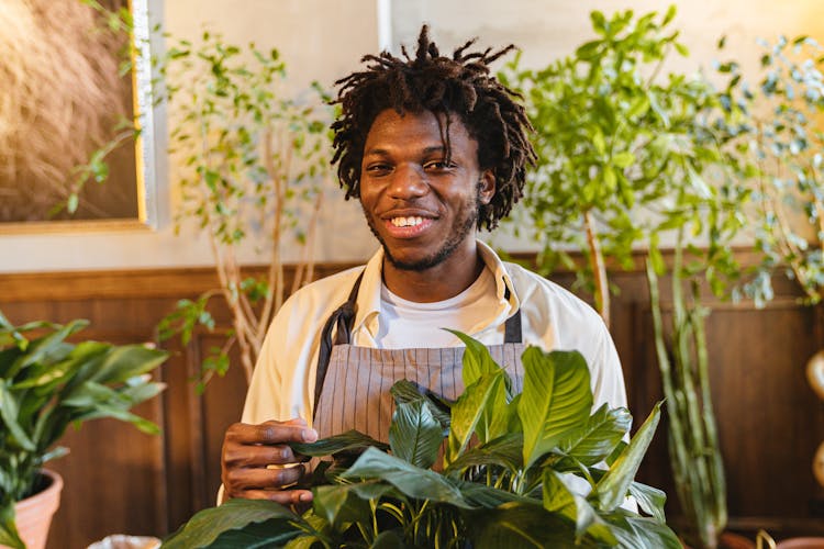 A Florist Man Near The Green Plants