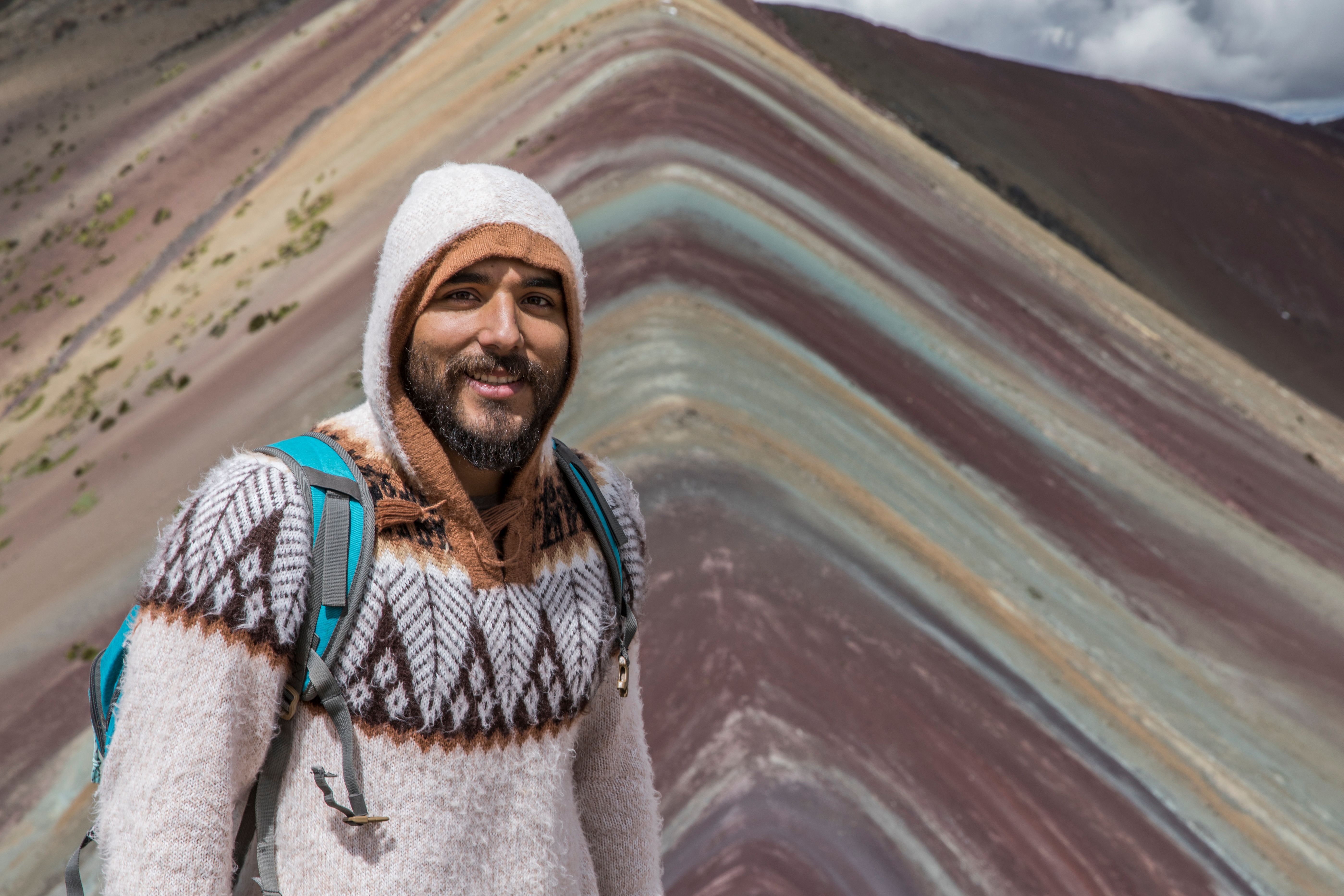 Stunning Iquitos: Wildlife Exploration along the Rio Negro | Full Day Review 2026 - A smiling man in a cozy sweater at Rainbow Mountain in Peru, a popular travel destination.