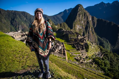 Free 

A Woman Wearing a Poncho with the Machu Picchu on the Background Stock Photo