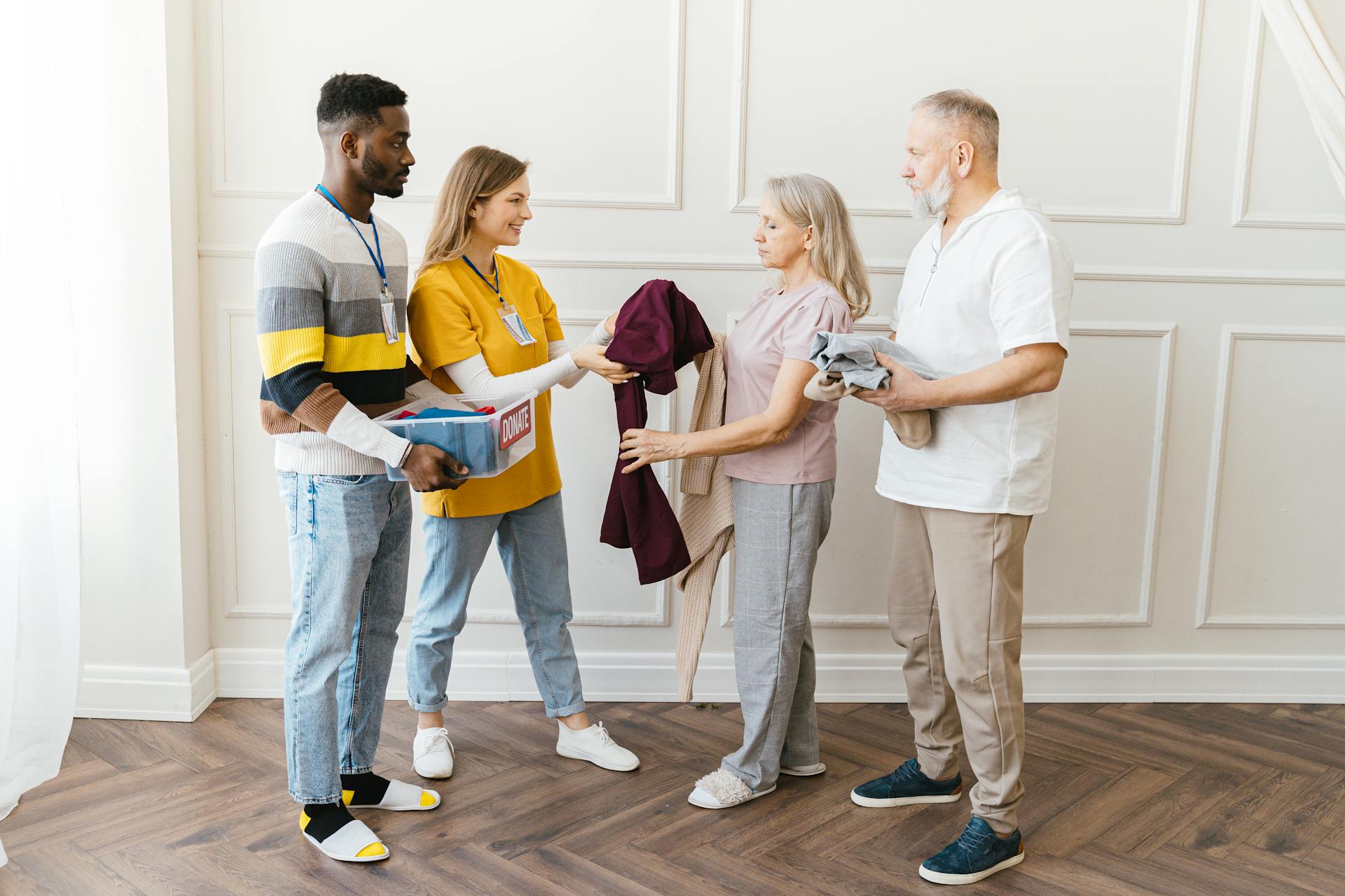 Volunteers Giving Donations to Elderly People