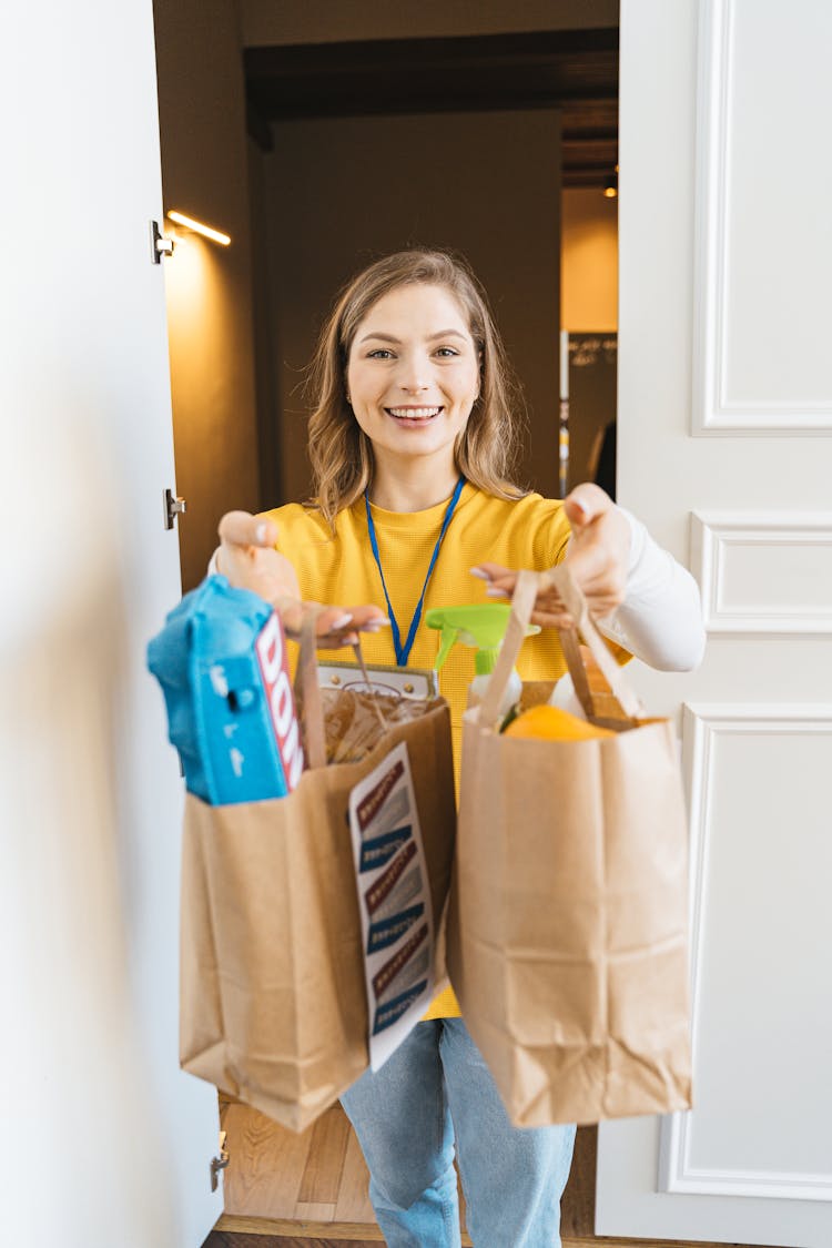 Woman Holding Paper Bags Of Groceries