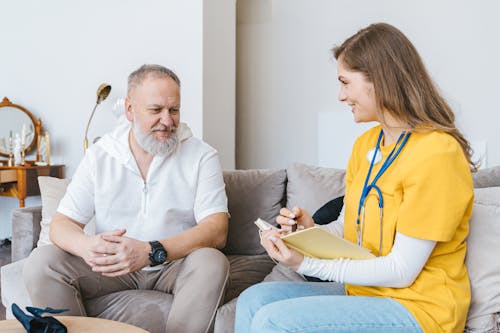 Man and Woman Sitting on the Couch