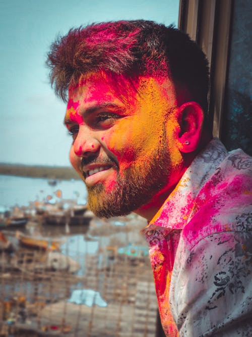 Man With Orange and Red Powder on His Face