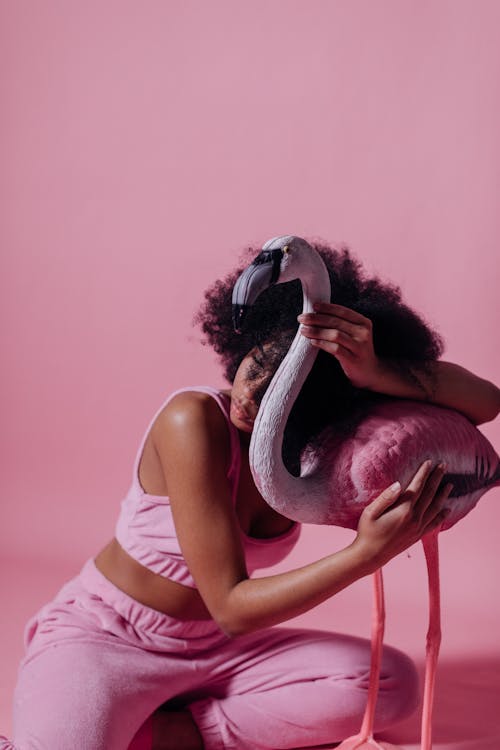 Woman Hugging a Pink Flamingo