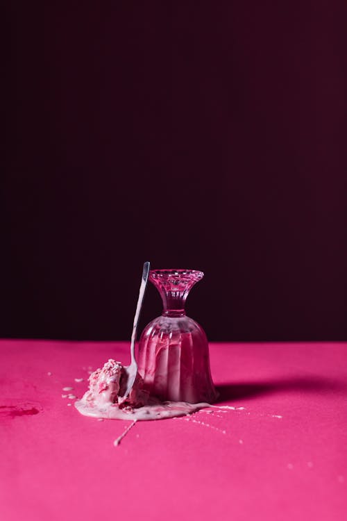 Free Ice Cream Spilled on Pink Table Stock Photo