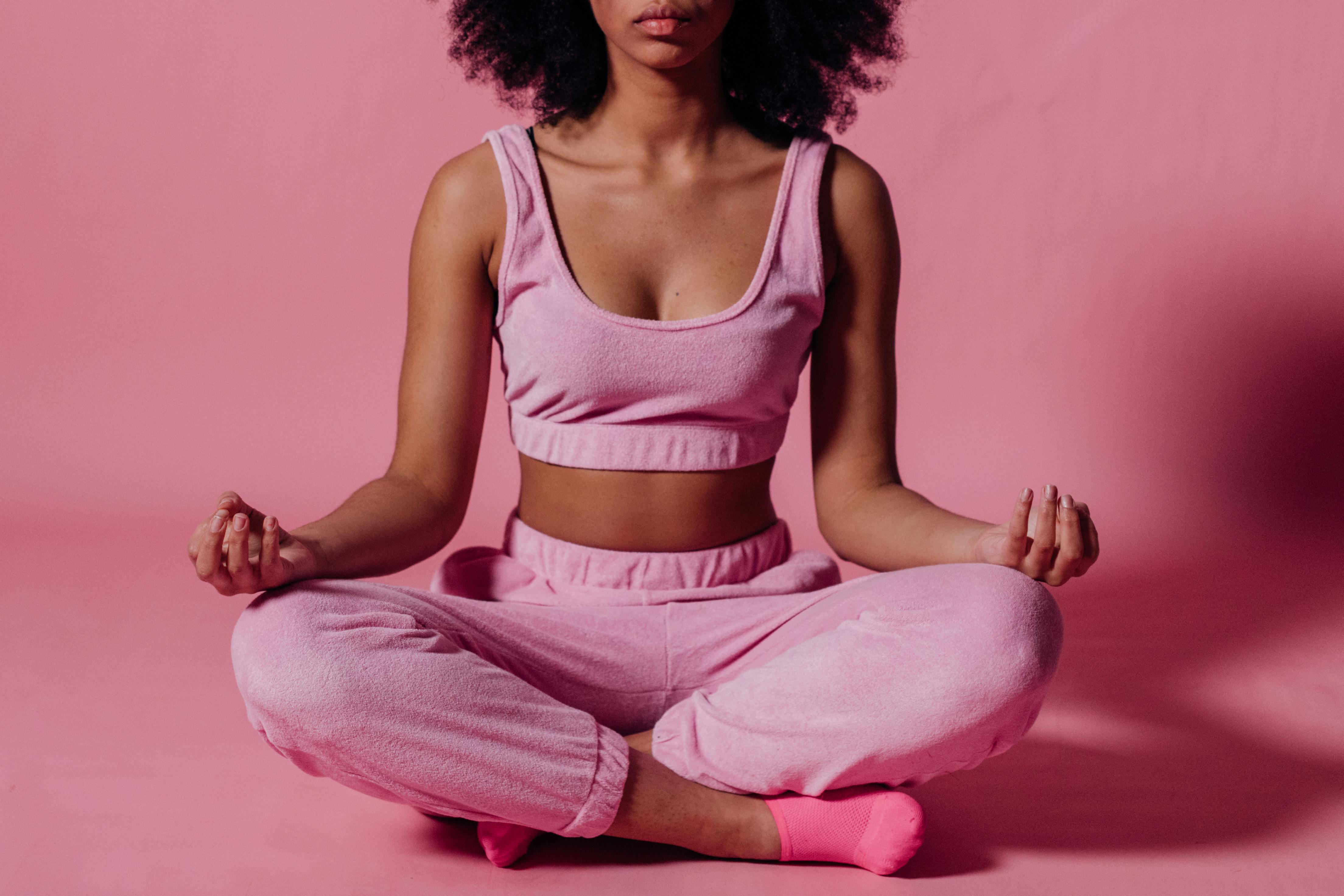 woman meditating to achieve abundance mindset after breakup