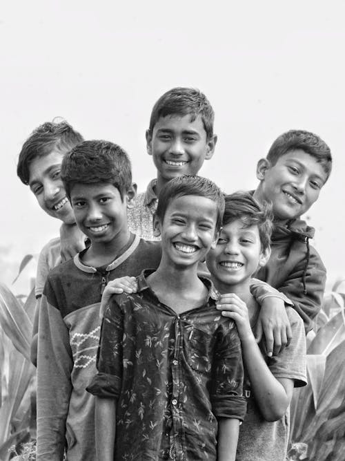 Free Monochrome Photograph of Boys Smiling Together Stock Photo