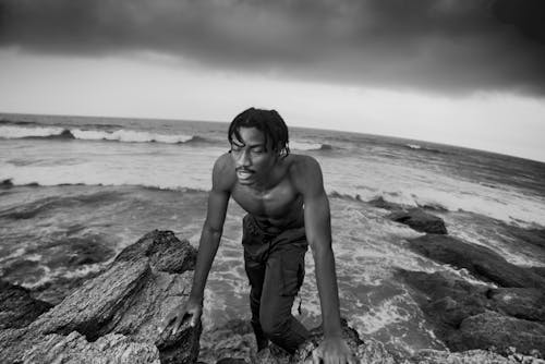 Grayscale Photo of Man at the Beach