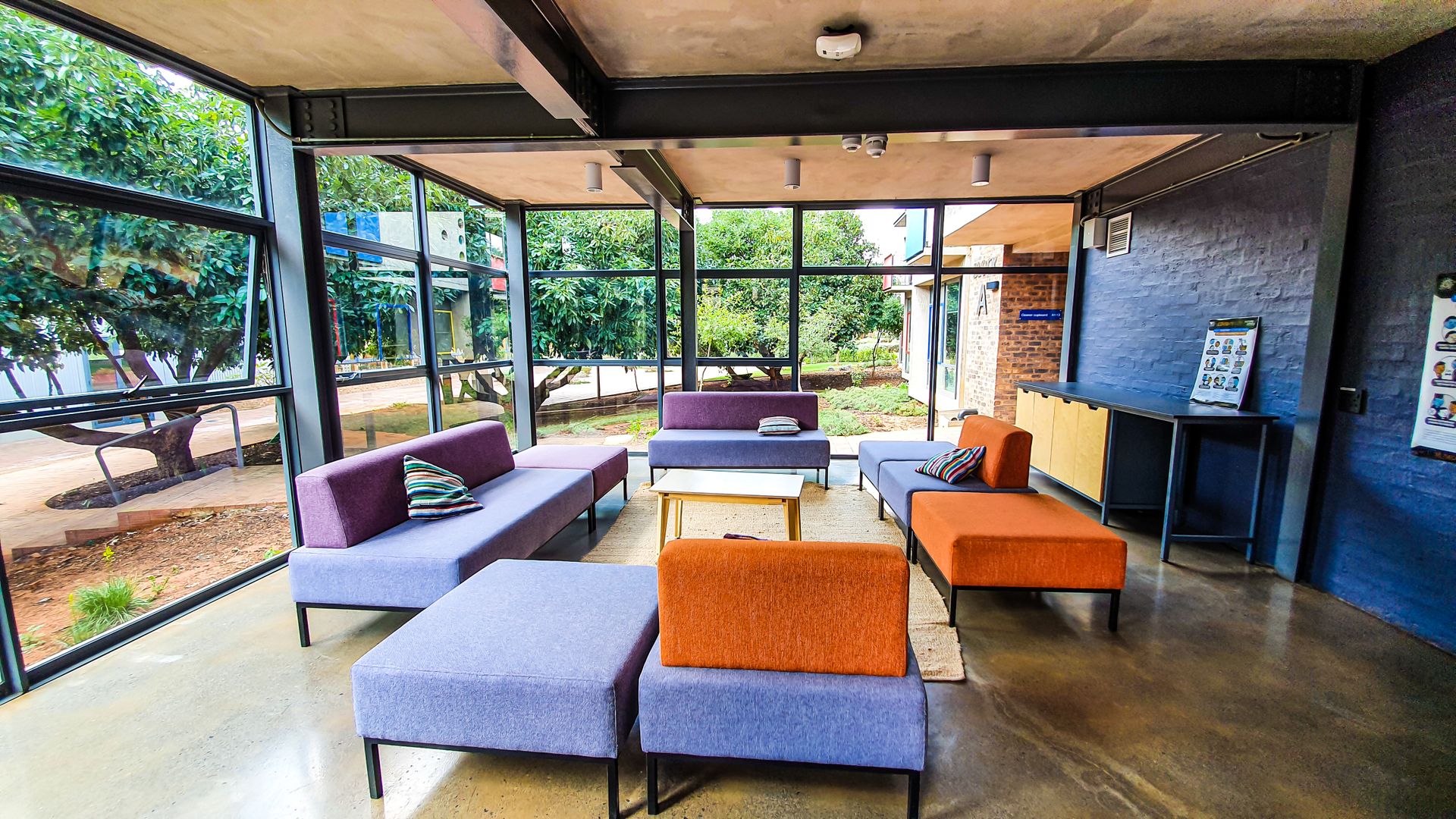 Contemporary lounge area with vibrant furniture and open views.