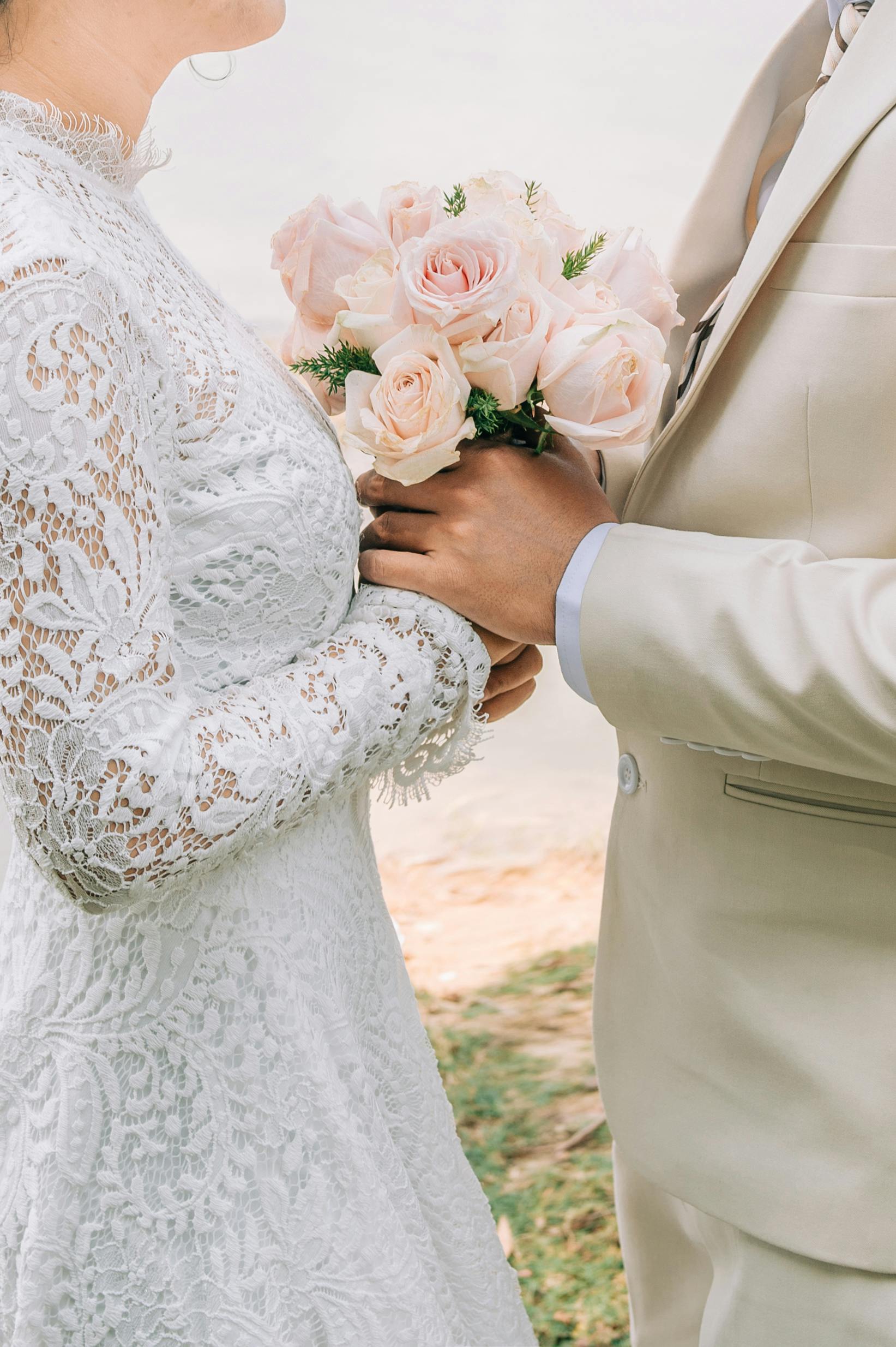 bride and groom with wedding bouquet