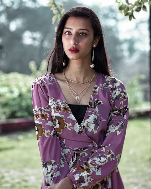 Woman in Purple and White Floral Dress