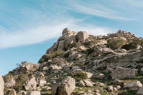 Free Explore the serenity of a rocky landscape with clear blue skies, perfect for outdoor adventures. Stock Photo