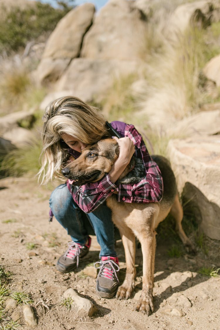 Woman Kissing Her Dog