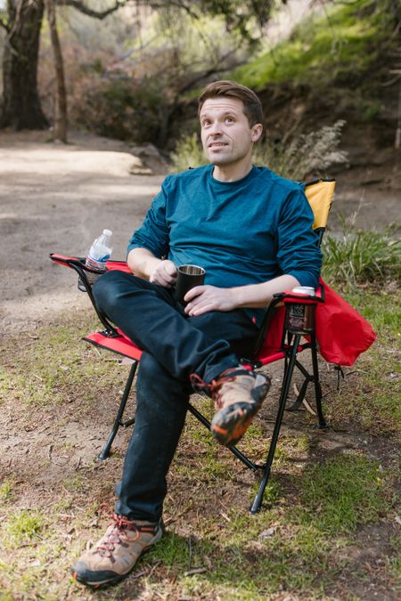 Man relaxing at a campsite