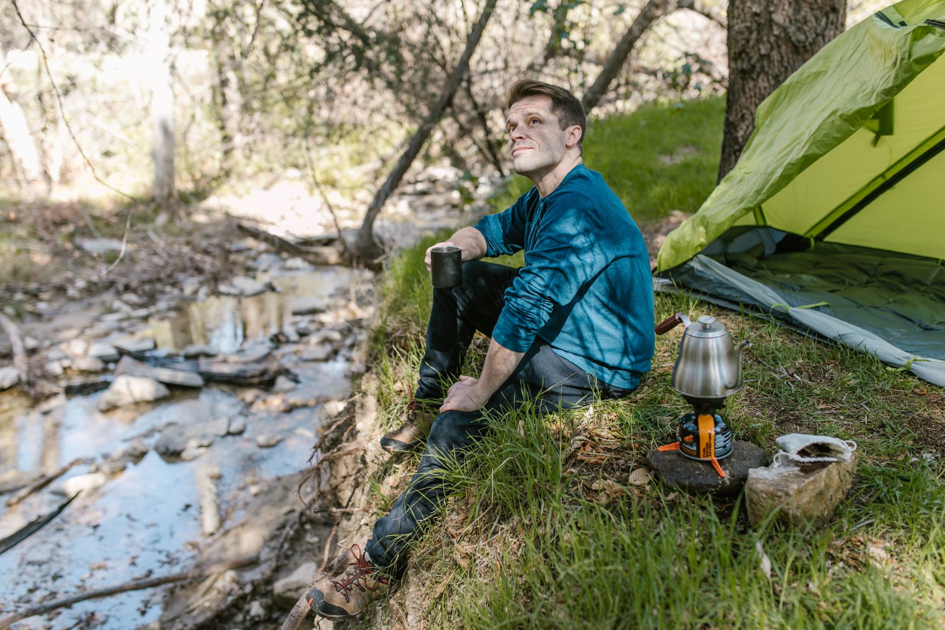 Solo camping by a stream