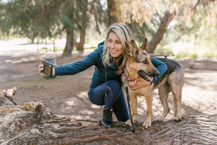 A Woman Doing A Selfie With Dog 