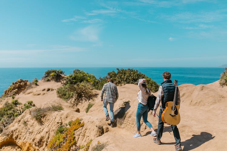 Group Of Friends Hiking A Mountain