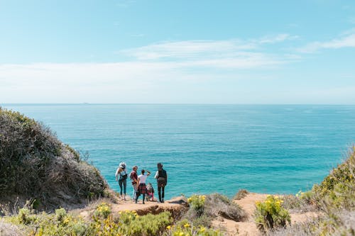 Photo of People Near the Ocean