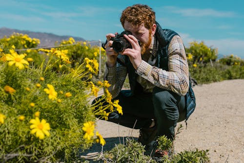 A Bearded Man Using Camera