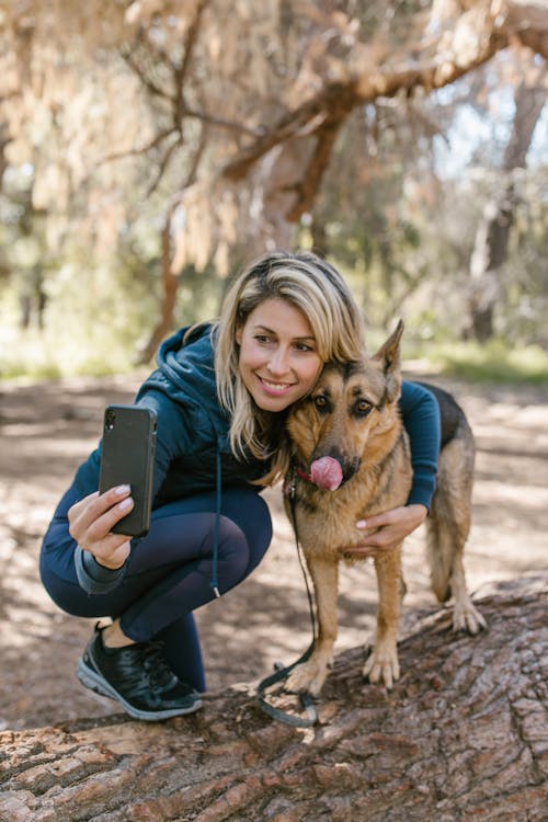 Free Woman Taking Selfie with Her Dog Stock Photo