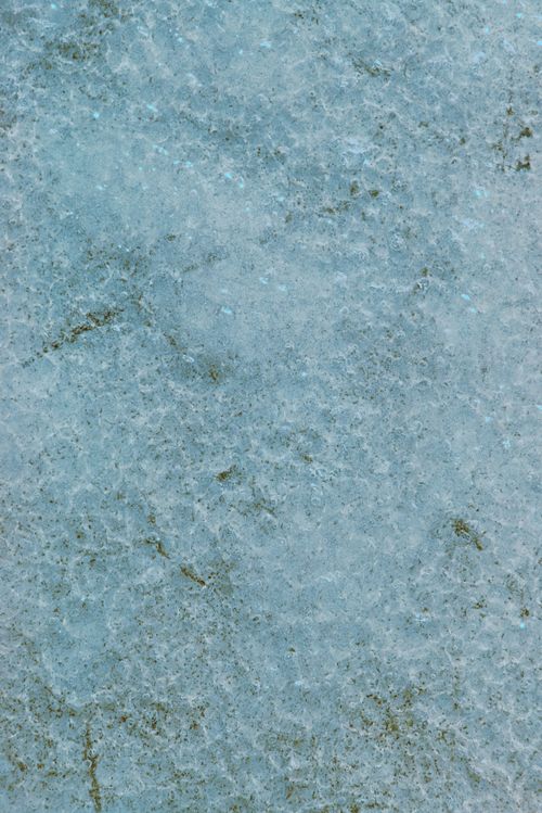 Free Close-up view of a light blue stone texture with rough surface details. Stock Photo