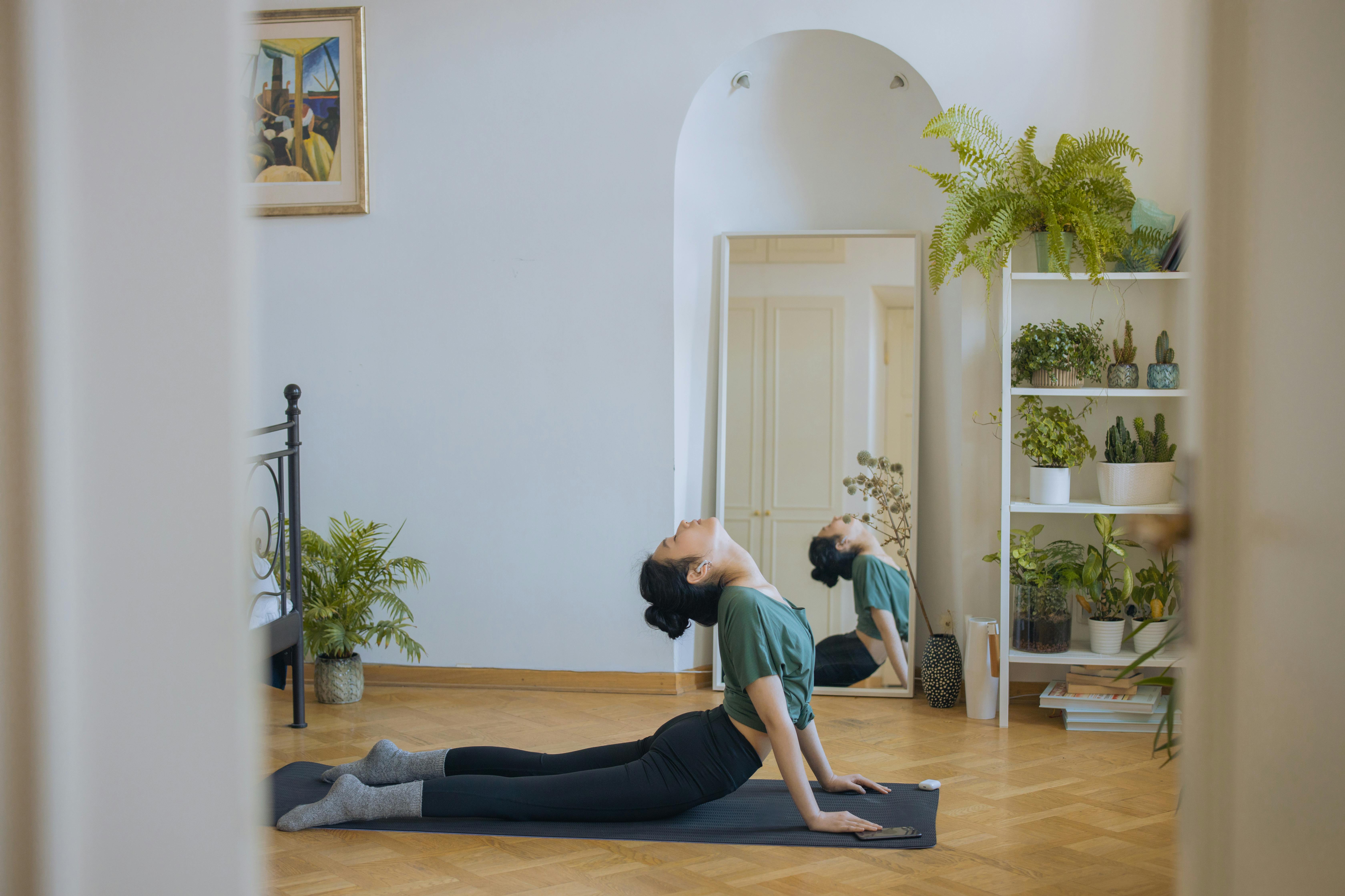 Free A Woman Doing Exercise at Home Stock Photo