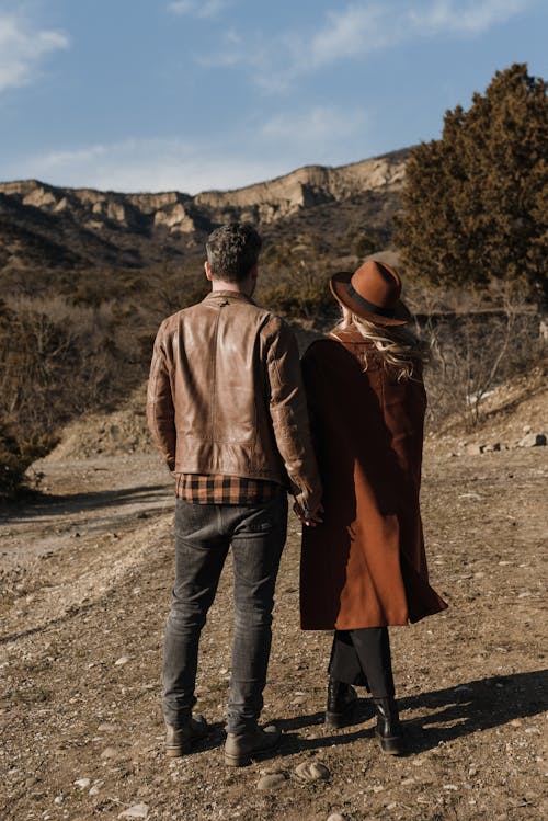 Back View of a Couple Holding Hands