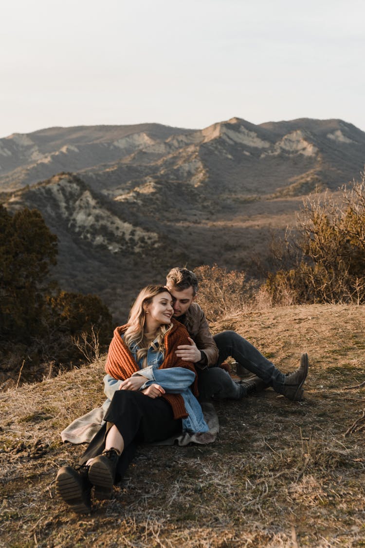 Couple Sitting On The Ground