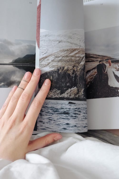 A Person Holding Photo Album