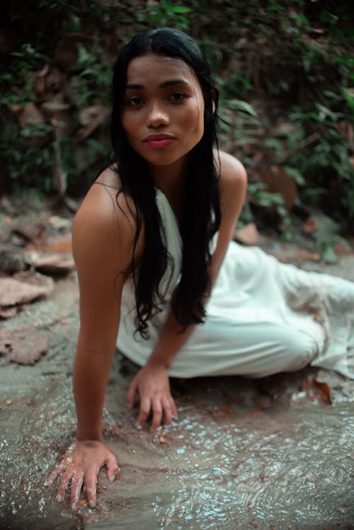 Woman in White Dress Sitting on Ground