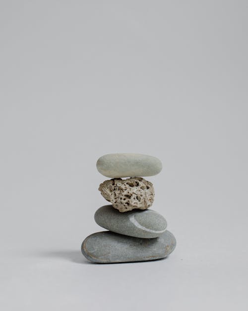 Rock Balancing on White Surface