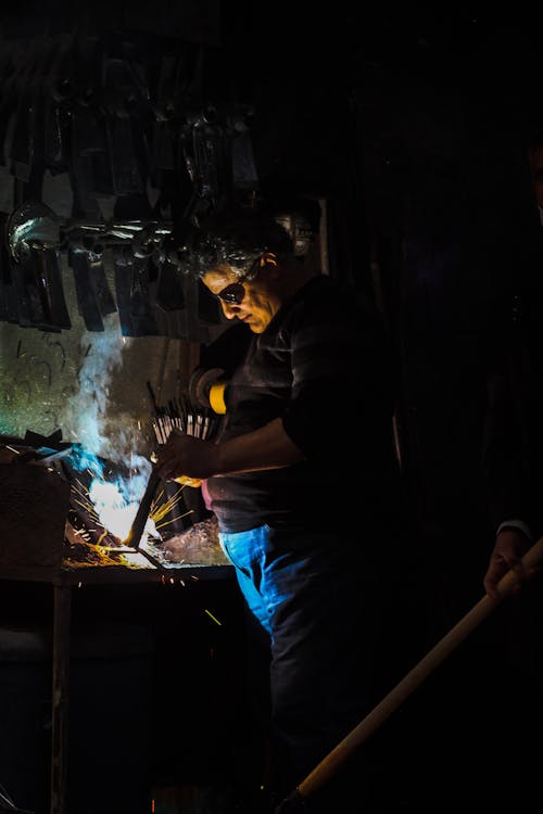 Blue-Collar Worker Working in a Workshop 