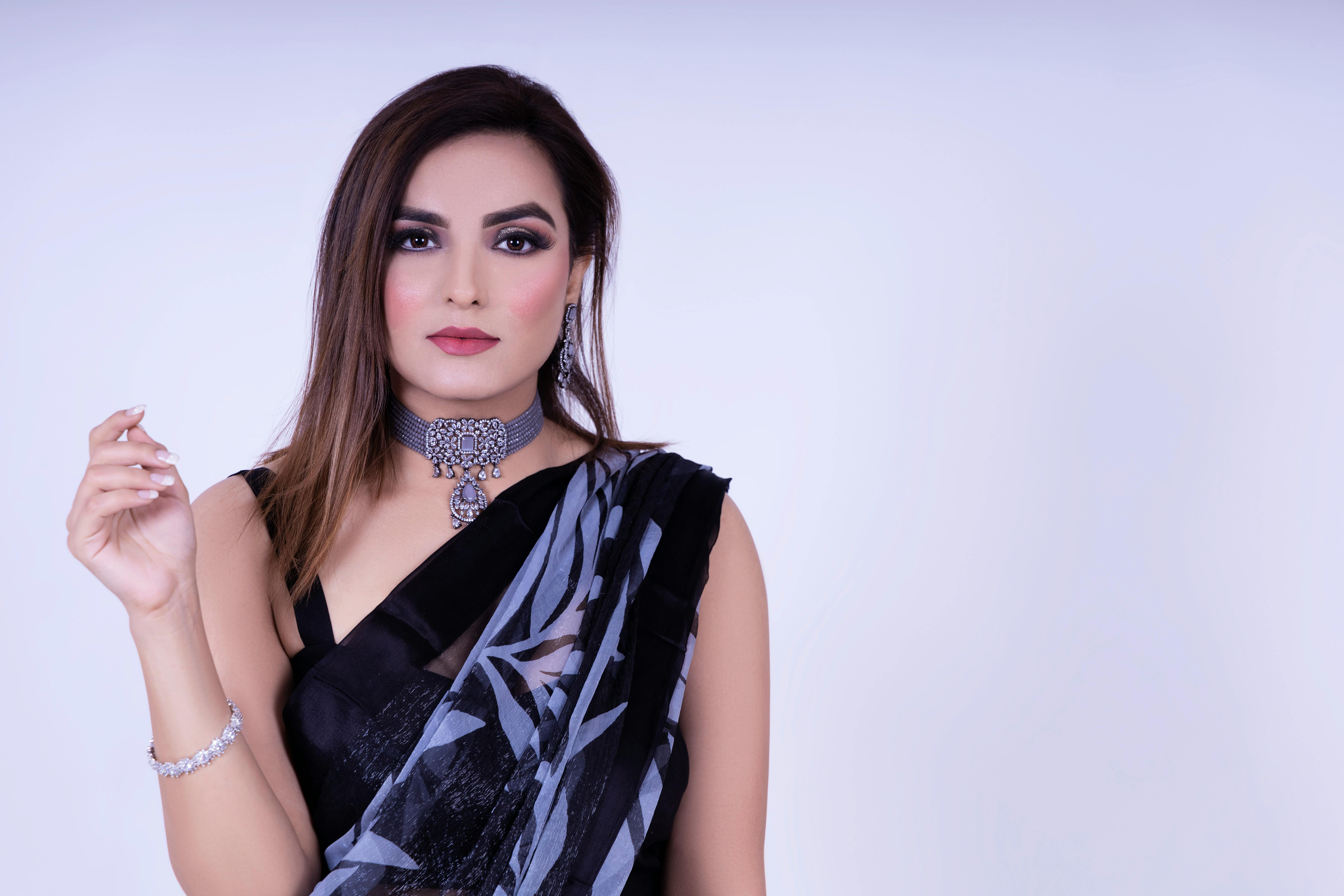 Woman in Black and White Floral Sleeveless Dress