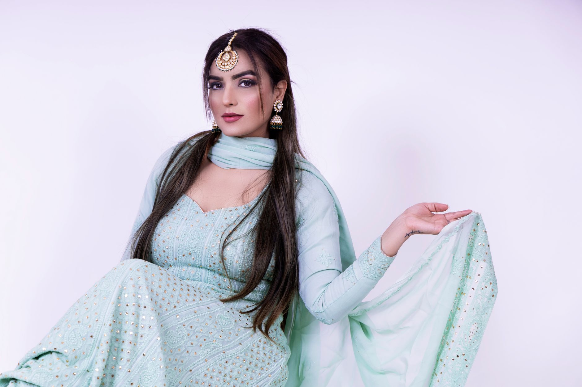 https://www.pexels.com/photo/a-woman-in-green-saree-7352535/