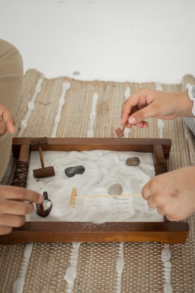 Unrecognizable People Playing Board Game