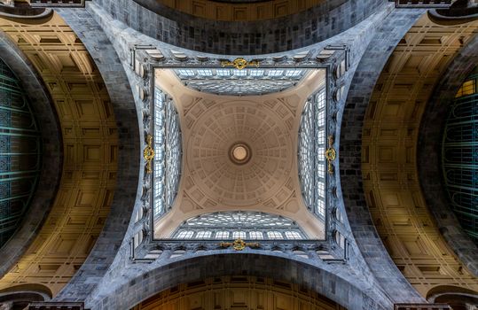 A stunning upward view of a geometric dome ceiling showcasing intricate patterns and symmetry.