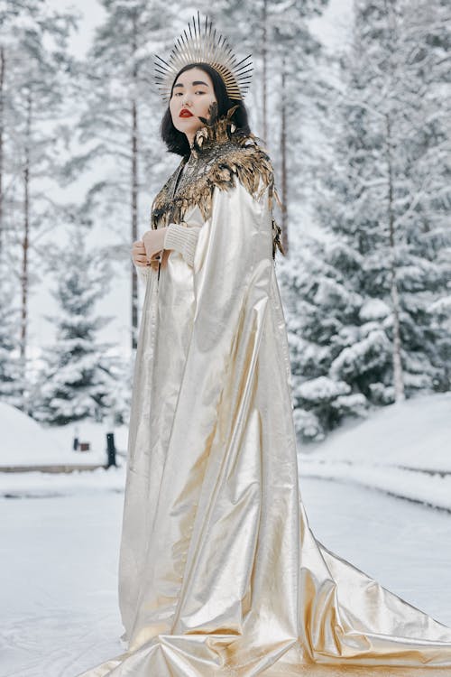 Free Woman Wearing a Cape and Crown Stock Photo