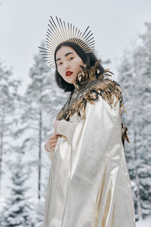 A Woman Wearing a White Dress and a Crown